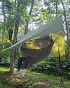 Swinging Between Trees: The Premier Outdoor Snuggle Station with Mosquito Protection for Couples